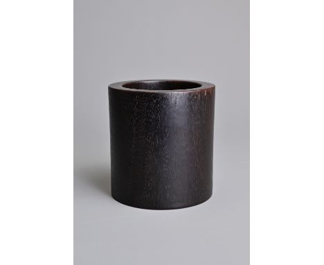 A SMALL CHINESE ZITAN BRUSH POT, BITONG. Very slightly tapered cylindrical form. 9.9cm tall. In good overall condition.