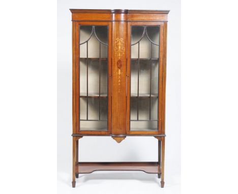 An Edwardian inlaid mahogany display cabinetWith a central convex panel inlaid with hanging harebells flanked by two astragal