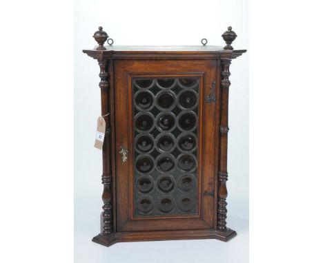 A late Victorian glazed hanging wall cabinetOf rectangular section, the glazed leaded door with concentric bullseye design, f