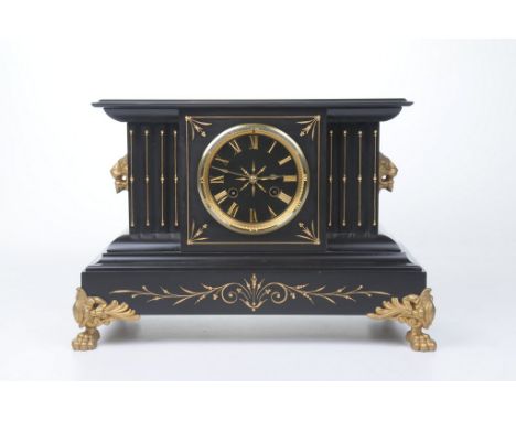 A Victorian black slate mantel clockThe Classical Architectural case, raised on gilt paw feet, with incised gilt scroll detai