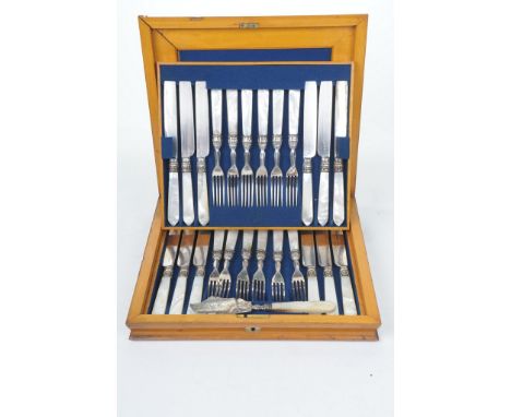 An Early 20th Century twelve setting EPNS CanteenThe hinged wooden box, enclosing two tiers each with Mother of Pearl handled