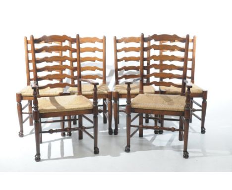 A Set of six reproduction oak ladder back dining chairs, 20th CenturyWith envelope rush seats raised upon turned front legs a