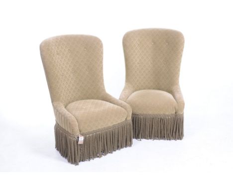 A Pair of 20th Century Colefax and Fowler upholstered tub chairsWith a convex arched button  back above a circular padded sea