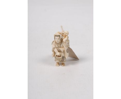 A Japanese ivory netsuke, Meiji/Taisho period The well carved and stained figure modelled as a mother and child, her dressed 