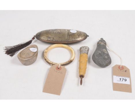 A mixed group of collectable itemsTo include a Chinese ingot (unmarked for silver), a Japanese carved ivory bangle, a cast me