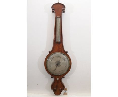 A late 19th Century T. Saunders of Dorchester Mahogany aneroid barometerThe scroll arch case, with silvered circular dial and