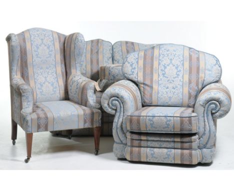 A Modern striped and leaf pattern lounge suiteComprising a two seater settee and armchair, also an early 20th Century wing ba