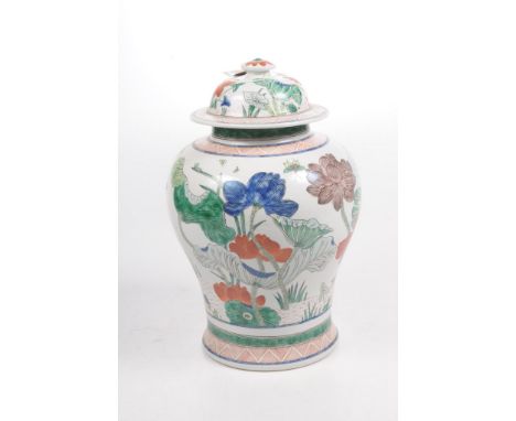 A Chinese Kangxi style wucai glazed jar and cover, 20th Century The meiping shaped vase, rising from a splayed base and surmo