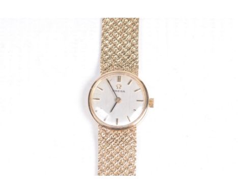 Omega: A 9ct gold Ladies manual wind bracelet wrist watchCircular face, with plaited straps, length 5.7cm, weight including m
