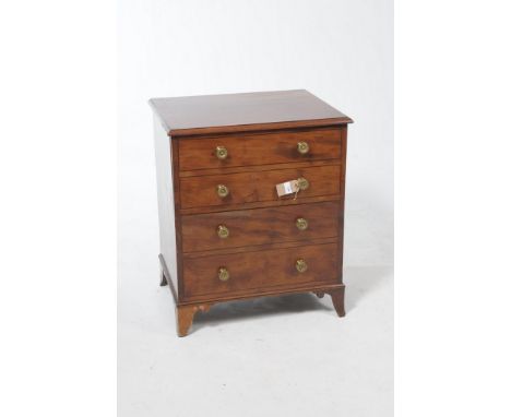 An early 19th Century mahogany commode chestWith four faux drawers each with ornate gilt metal handles and overall inlaid str