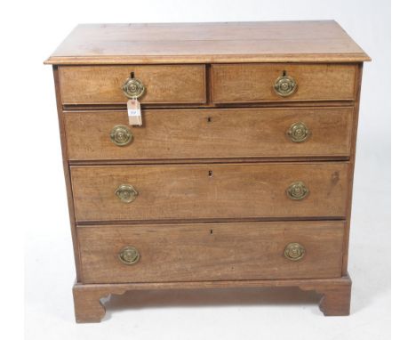 George III mahogany chest, banded caddy top with moulded edge, brushing  slide over four graduating cock-beaded drawers, ornate cast gilt metal  handle plates and escutcheons, swan neck handles cast wit - The