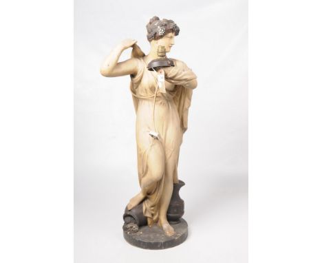 An early to mid-20th century plaster figural lamp standModelled as a classical maenad dressed in robes and wearing grape head