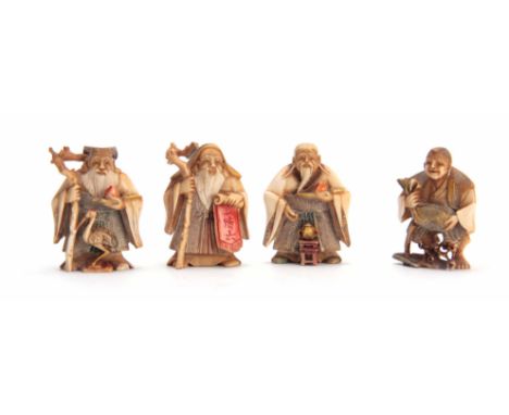 A SET OF FOUR EARLY 20th CENTURY STAINED IVORY NETSUKE sculptured as for elderly men, all with character marks (4)