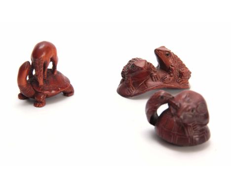 A COLLECTION OF THREE EARLY 20th CENTURY HARDWOOD NETSUKE sculptured as various animals all with character marks (3)
