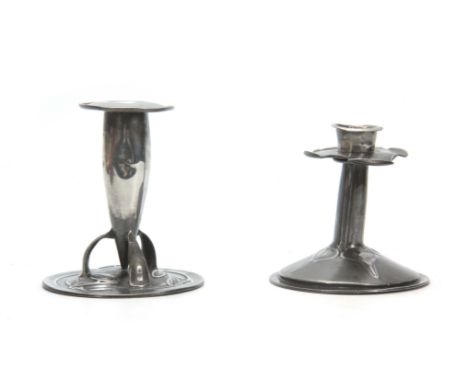 TWO ARTS AND CRAFTS PEWTER CANDLESTICKS the taller bullet-shaped Liberty style candlestick having three curved supports on a 