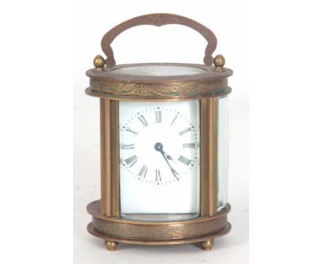 A LATE 20th CENTURY OVAL CASED CARRIAGE CLOCK having chased scrollwork decoration enclosing a 40mm porcelain dial fronting a 