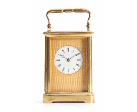 A19th CENTURY FRENCH STRIKING CARRIAGE CLOCK the moulded Corniche style case inset with five bevelled glass panels enclosing 