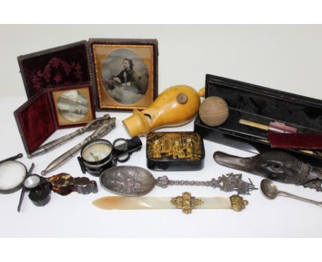 Assorted works of art to include boxwood train whistle, ambrotype portraits, 19th century compass, papier mâché boxes, emboss