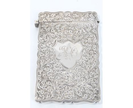 Victorian silver card case of shaped rectangular form with engraved foliate decoration, cartouche with engraved monogram and 