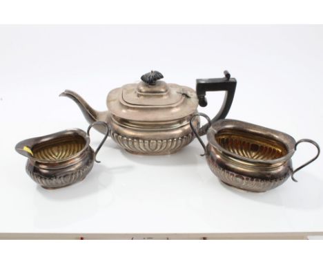 Georgian-style silver fluted teapot (Birmingham 1927) and matching sugar basin and milk jug (Sheffield 1927).  All at approxi