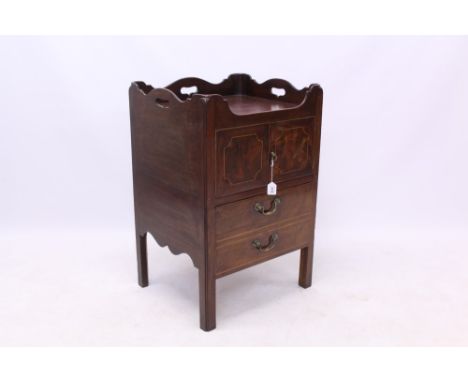 George III mahogany bedside cupboard with undulating gallery top and two boxwood line inlaid cupboard doors over commode draw