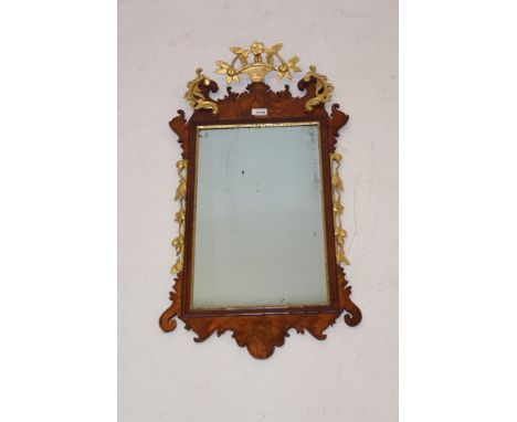 18th century walnut and parcel gilt fret carved wall mirror, the original rectangular plate in gilt slip and fret surround wi