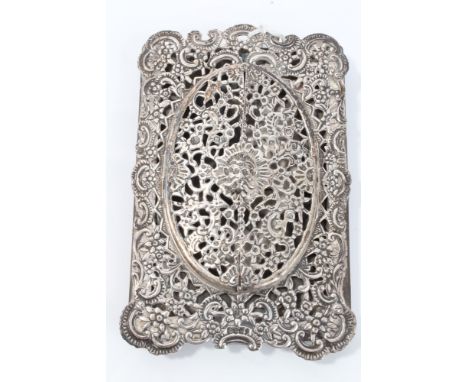 Victorian silver photograph frame of vertical rectangular form, with pierced scroll and floral decoration and two hinged fron