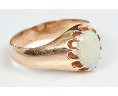 Russian rose gold and opal single stone ring, the oval cabochon opal in heavy claw setting, on polished gold shank.  Russian 