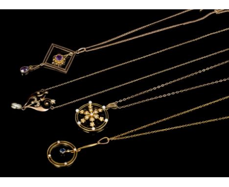 Four Edwardian gold and gem set pendant necklaces on chains - to include two seed pearl pendants, amethyst necklace and a see