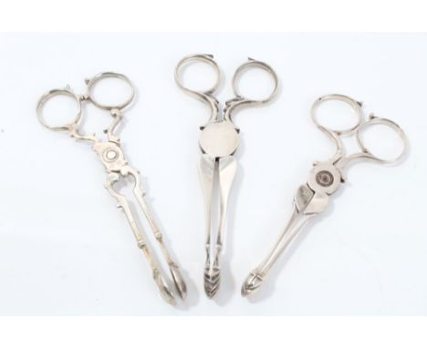 Pair mid-18th century silver scissor-action sugar nips, with cutter stems, overlapping ring hinge and shell bowls, together w