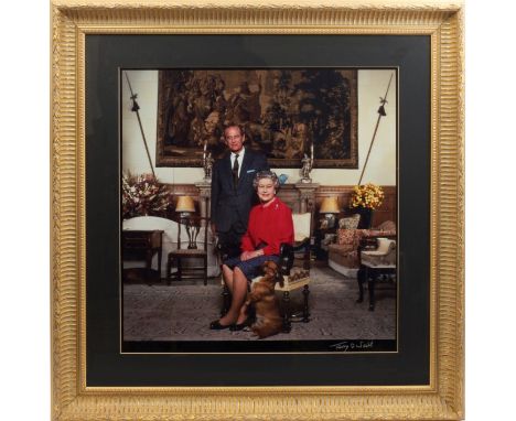 Terry O'Neill - fine signed colour photograph of HM Queen Elizabeth II and HRH The Duke of Edinburgh, with a Dorgi standing o