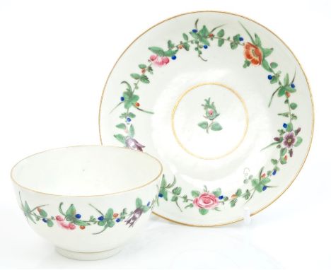 Mid-18th century Worcester tea bowl and saucer with finely painted polychrome floral spray bands