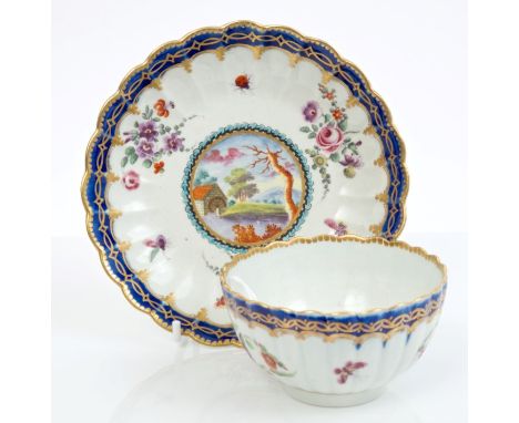 Fine mid-18th century Worcester Earl Dalhousie pattern fluted tea bowl and saucer finely painted with landscape reserves, flo