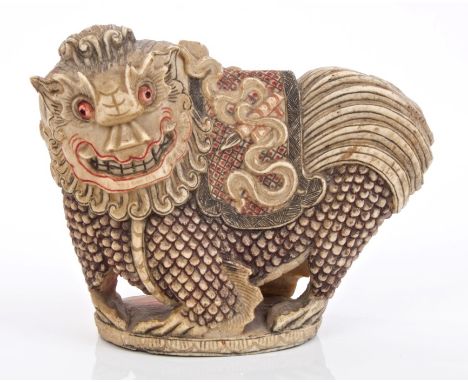 Fine Chinese Qing period carved bone scholar's seal in the form of a temple lion with saddle on back, carved with brush and s