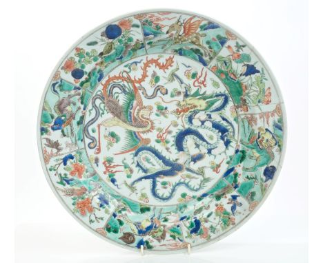 Early 18th century Chinese export famille verte charger, finely painted with dragon and hoho bird within segmented border wit