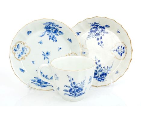 18th century Worcester fluted coffee cup and two saucers with dry-blue and gilt floral decoration (3)