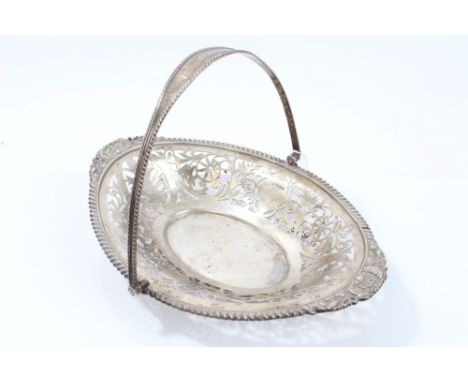 Edwardian silver oval cake basket with pierced scrollwork decoration and swing handle, hallmarked Sheffield 1910, 27cm, 12ozs