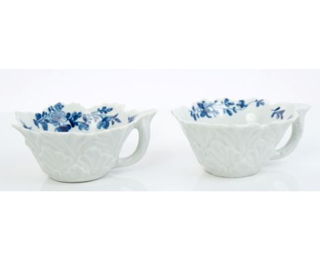 Pair 18th century Worcester blue and white pickle dish of moulded leaf-shaped form, with stalk handles and painted floral spr