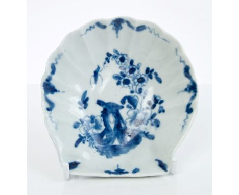 18th century Worcester blue and white shell-shaped butter dish with painted insect, flora and rock and moulded underside and 