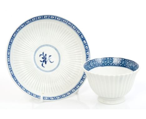 18th century Worcester fluted tea bowl and saucer with cagework border - blue crescent mark, 15cm diameter