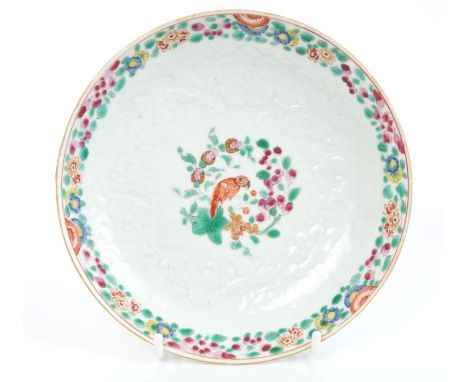 18th century Worcester polychrome saucer with bianco sur bianco moulded flowers and painted parrot to centre and floral borde