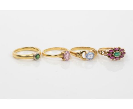 Group of four gold and gem set dress rings - to include an emerald and ruby cluster ring, a pink sapphire single stone ring, 