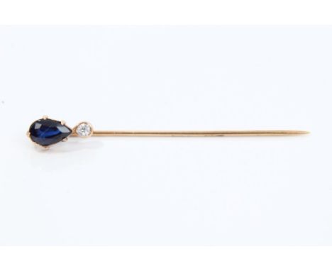 Sapphire and diamond stick pin, the pear cut blue sapphire with an old cut diamond below 