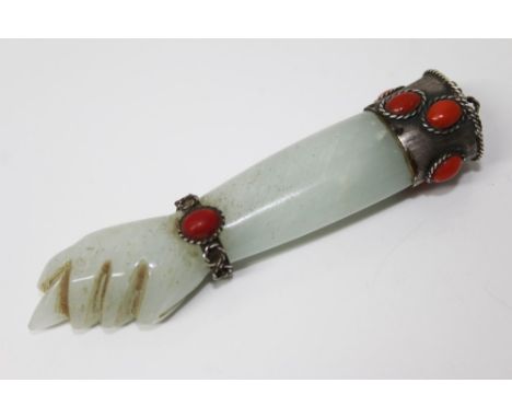 Antique Chinese jade, white metal and coral mounted pendant in the form of a forearm, with loop suspension, 10cm long