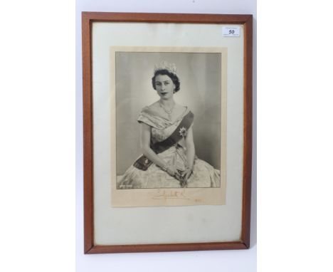 HM Queen Elizabeth II - signed presentation portrait photograph of The Young Queen, wearing a diamond diadem, necklace, brace