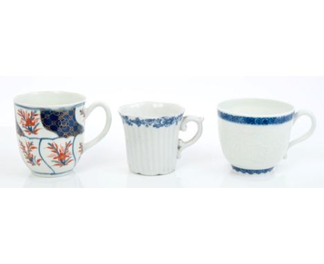 18th century Worcester blue and white fluted coffee cup with floral band and moulded handle, 5cm, another with bianco sur bia