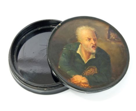 Good 19th century Continental painted papier mâché snuff box of circular form, painted with a miser, indistinctly inscribed t