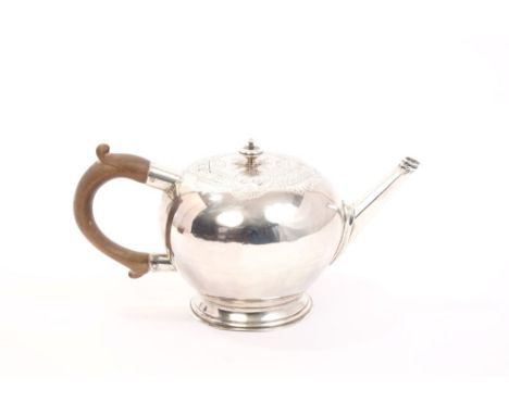 Early 18th century silver teapot of bullet form and small proportions, with fruitwood scroll handle and straight octagonal sp