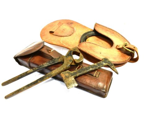 A LEATHER POUCH FOR A SPARE HORSESHOE 39 x 18cm; and a leather pouch with tools for fitting horseshoe, 30 x 10cm (2)