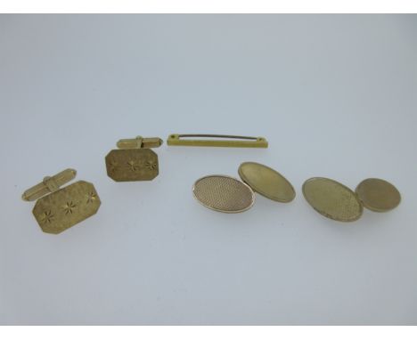 the first a pair of double ended oval cufflinks, one end engine turned, chain connections, Birmingham hallmarks 1960; the sec
